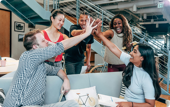 Engineers working with holographic AI technology in a futuristic lab environment